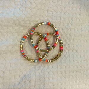 Roxanne Assoulin set of slip on bracelets.